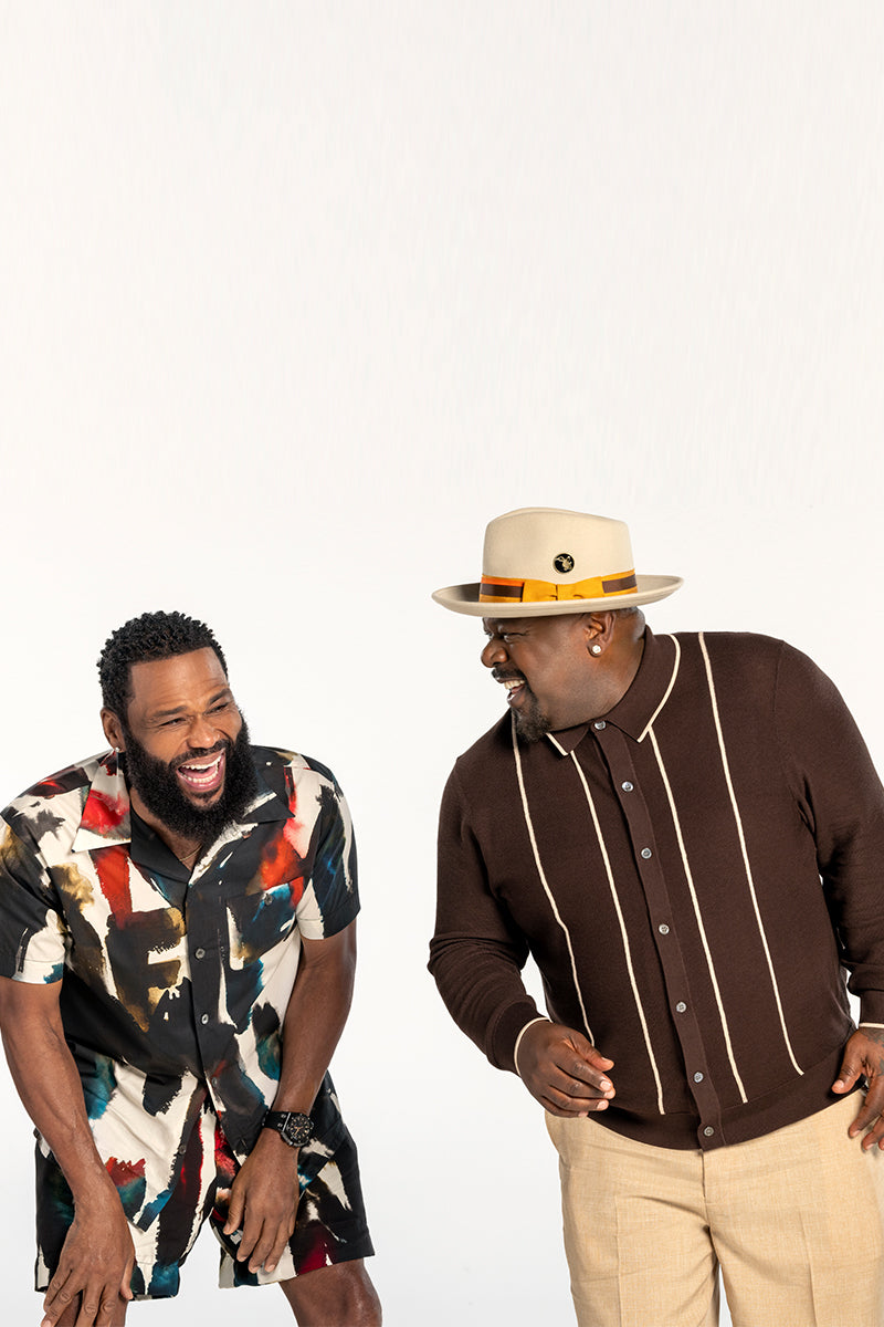 Anthony Anderson and Cedric the Entertainer smiling and laughing